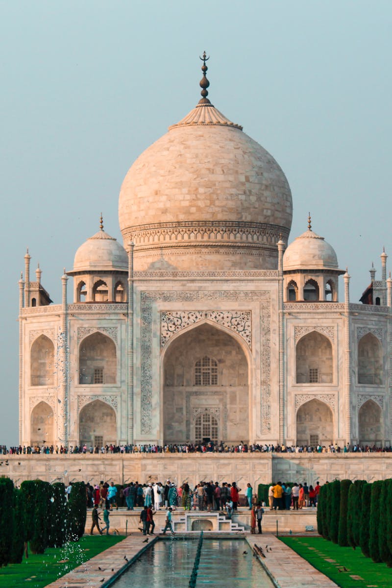 A stunning shot of the Taj Mahal in Agra, showcasing its iconic architecture and serene surroundings.