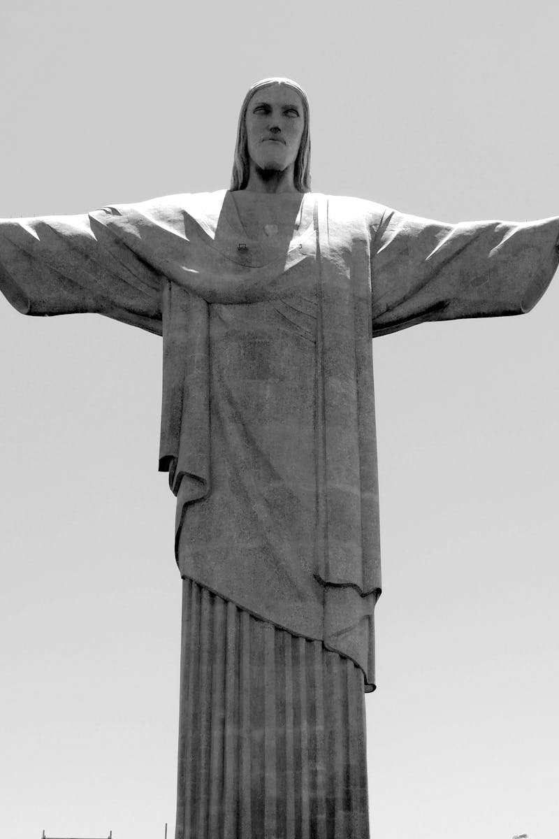 Black and white photo of the iconic Christ the Redeemer statue in Rio de Janeiro, Brazil.